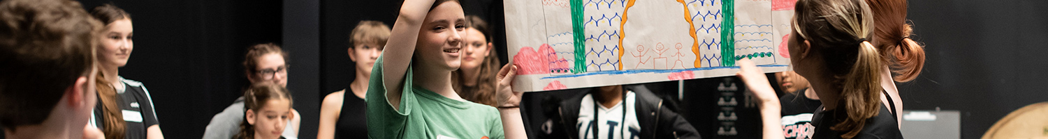 Children holding up a poster